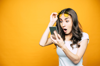 Can the Booming Prediction Market Wave Buoy These 5 Cryptocurrencies?: https://g.foolcdn.com/editorial/images/852662/shocked-investor-with-smartphone.jpg