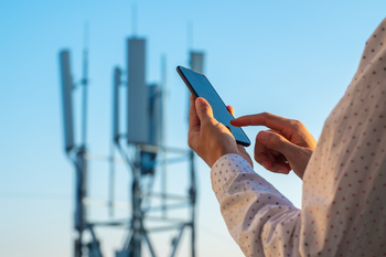 Forget AI Stocks: This Infrastructure REIT Is Wall Street's Secret Weapon: https://g.foolcdn.com/editorial/images/852319/a-person-holding-a-cell-phone-next-to-a-cell-tower.jpg