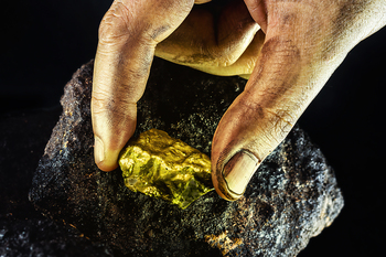Should You Buy Gold Stocks Newmont and Barrick on the Dip?: https://g.foolcdn.com/editorial/images/854367/hand-gold-rock.jpg