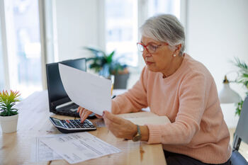 How Much Is Your Required Minimum Distribution With $462,410 in Your Retirement Account?: https://g.foolcdn.com/editorial/images/851177/older-bank-customer-banking-online.jpg