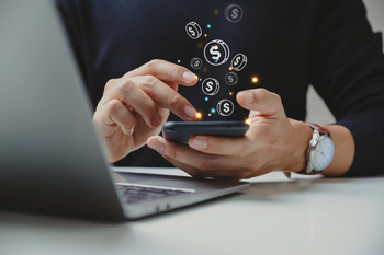 Better Growth Stock: Nu Holdings vs. SoFi Technologies: https://g.foolcdn.com/editorial/images/853665/handling-finances-on-mobile-device.jpg