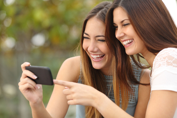 1 Unstoppable Stock to Buy Before It Joins Nvidia, Apple, Microsoft, and Alphabet in the $3 Trillion Club: https://g.foolcdn.com/editorial/images/854105/two-people-laughing-while-watching-a-video-on-a-smartphone.jpg