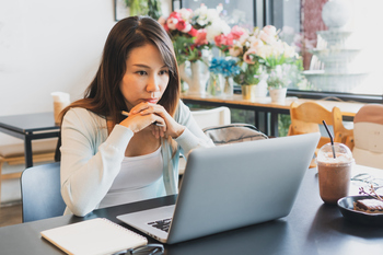 Nervous to Invest Your Retirement Savings in Stocks? Here's What Might Happen if You Don't.: https://g.foolcdn.com/editorial/images/853436/woman-30s-laptop-serious-gettyimages-1410857778.jpg