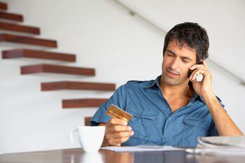 Why Tariffs Could Weigh on Amazon's Business This Year: https://g.foolcdn.com/editorial/images/853985/person-on-the-phone-while-holding-a-credit-card.jpg
