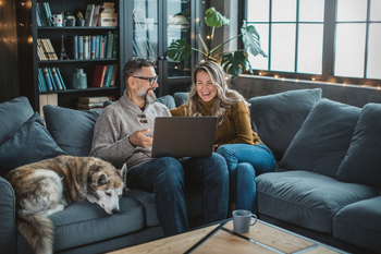 Married? Here's How to Tell If You're Eligible for Spousal Social Security Benefits.: https://g.foolcdn.com/editorial/images/853921/two-older-people-sitting-on-a-couch-looking-at-a-laptop.jpg