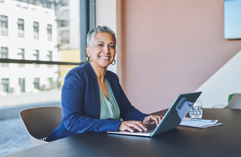 The 1 Sign You're Not Ready to Retire That You Can't Overlook: https://g.foolcdn.com/editorial/images/854370/senior-woman-laptop-smiling-gettyimages-1414393948.jpg