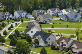 How Much Lower Can Opendoor Technologies Stock Go?: https://g.foolcdn.com/editorial/images/860080/a-photo-of-several-houses-in-a-new-residential-suburb-surrounded-by-lush-greenery.jpg