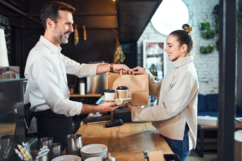 Better Stock to Buy Right Now: Dutch Bros vs. Starbucks: https://g.foolcdn.com/editorial/images/859458/woman-buys-coffee-and-snacks.jpg