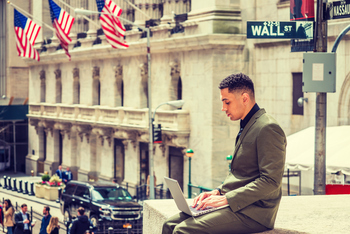 Wall Street Likes SanDisk More Than Micron. Should You?: https://g.foolcdn.com/editorial/images/860599/wall-street-young-man-with-laptop.jpg