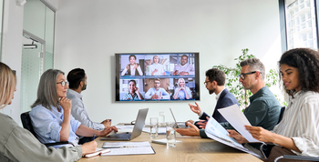 Why ServiceNow Stock Edged Past the Market Today: https://g.foolcdn.com/editorial/images/861030/people-in-a-conference-room-engaging-in-a-video-conference.jpg