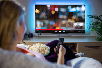 Netflix vs. Disney: Which Streaming Giant Is the Better Buy for 2026 and Beyond?: https://g.foolcdn.com/editorial/images/860295/woman-streaming-on-tv-with-popcorn-1201x801-d21b45d.jpg