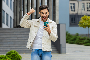 4 Monster Stocks to Hold for the Next 5 Years: https://g.foolcdn.com/editorial/images/859662/person-celebrating-while-looking-at-their-phone.jpg