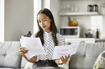 Got $1,500? Is It Better to Buy Bitcoin, or Viking Therapeutics?: https://g.foolcdn.com/editorial/images/861126/investor-inspects-papers-on-a-couch.jpg