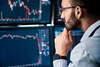 Is Solana a Buy Right Now?: https://g.foolcdn.com/editorial/images/860668/trader-pondering-at-screens.jpg