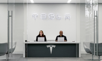 Why April Could Be a Turning Point for Tesla Stock: https://g.foolcdn.com/editorial/images/862239/tesla-service-center-with-two-associates-at-desk-with-tesla-logo.png