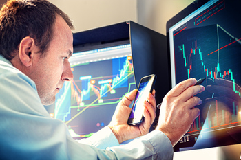 This Is the Smartest ETF to Buy as the Dow Jones Industrial Average and Nasdaq Composite Enter Correction Territory: https://g.foolcdn.com/editorial/images/863283/stock-trader-analyst-fund-manager-buy-sell-chart-decline-bear-market-smartphone-getty.jpg