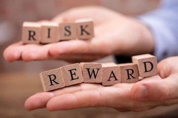 Should You Buy Vanguard Energy ETF or Chevron?: https://g.foolcdn.com/editorial/images/863519/23_02_20-hands-holding-blocks-spelling-risk-and-reward-_mf-dload.jpg
