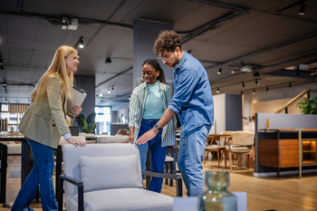 These 2 Major Retailers Just Declared Dividend Raises. Should You Buy Them Now?: https://g.foolcdn.com/editorial/images/863639/three-people-inspecting-a-chair-at-a-retail-store.jpg