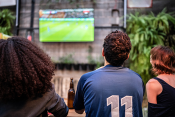 How Netflix Is Playing the Sporting Rights Game to Win, by Playing It Differently: https://g.foolcdn.com/editorial/images/863601/watching-a-streamed-sporting-event.jpg