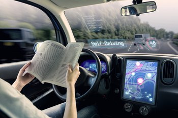 Why Uber Keeps Partnering Instead of Building Its Own Tech -- And What It Means For Investors: https://g.foolcdn.com/editorial/images/863736/person-reading-a-book-behind-the-wheel-of-a-self-driving-car.jpg