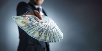 Investing $8,000 In Each of These 3 Stocks in 2026 Could Generate $1,500 in Annual Dividends: https://g.foolcdn.com/editorial/images/865250/a-person-holding-many-bills.jpg
