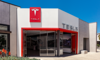 Tesla in 3 Years: Boom, Bust, or Quietly Crushing It?: https://g.foolcdn.com/editorial/images/865081/tesla-sales-center-with-tesla-logo-on-building-for-tesla-sales.png