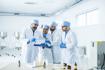 Where Will Pfizer Stock Be in 3 Years?: https://g.foolcdn.com/editorial/images/864840/a-group-of-scientists-looking-at-a-report.jpg