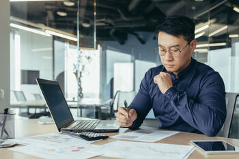 3 S&P 500 Dividend Stocks Marked Down as Much as 37%: https://g.foolcdn.com/editorial/images/862884/thinking-man-at-a-desk-reviewing-paperwork.jpg