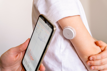 Better Medical Device Stock Right Now: Abbott Laboratories vs. Dexcom: https://g.foolcdn.com/editorial/images/864838/person-using-a-cgm-system.jpg