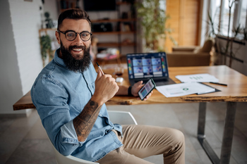 I'd Buy More of These 2 Dividend Stocks Before the Market Figures Out What It's Missing: https://g.foolcdn.com/editorial/images/865091/happy-stock-investor-holding-smartphone.jpg