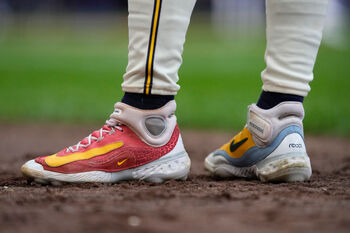 Nike Is Now the Third Highest-Yielding Dividend Stock in the Dow Jones Industrial Average. Should You Follow Apple CEO Tim Cook's Lead and Buy Nike Near a 10-Year Low?: https://g.foolcdn.com/editorial/images/866513/nike_shoes_on_baseball_field_with_logo_nke.jpg
