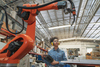 Why Honeywell Stock Tumbled on Thursday: https://g.foolcdn.com/editorial/images/867101/warehouse-robot-with-person-in-the-background.jpg