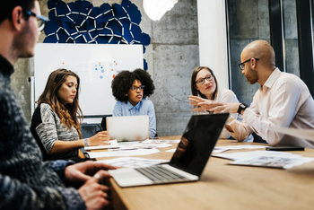 I Bought Atlassian Stock Earlier This Month After Its 87% Plunge. Here's Why.: https://g.foolcdn.com/editorial/images/866708/a-group-of-five-colleagues-seated-at-a-large-table-collaborating-at-work.jpg