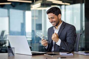 This Beaten‑Up Dividend Stock Is Ready for a Rebound Few See Coming: https://g.foolcdn.com/editorial/images/866592/a-happy-person-holding-money-in-front-of-their-computer.jpg