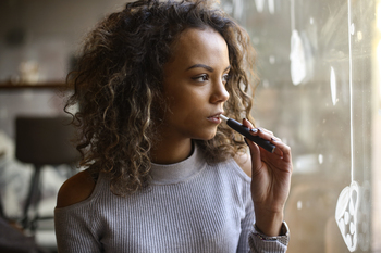 Why Altria Group Stock Topped the Market on Tuesday: https://g.foolcdn.com/editorial/images/867591/person-using-a-vaping-product.jpg