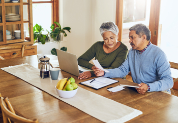 3 Dividend Stocks to Buy and Hold Forever: https://g.foolcdn.com/editorial/images/867036/an-older-couple-with-a-computer-and-papers.jpg