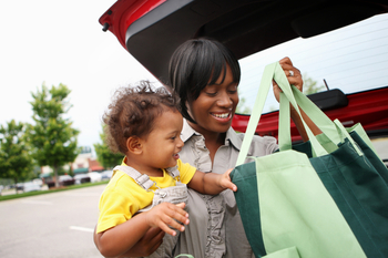 Better Buy: Walmart or Costco Stock: https://g.foolcdn.com/editorial/images/867692/a-person-with-a-baby-putting-grocery-bags-in-a-car-trunk.jpg