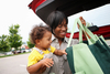 Better Buy: Walmart or Costco Stock: https://g.foolcdn.com/editorial/images/867692/a-person-with-a-baby-putting-grocery-bags-in-a-car-trunk.jpg