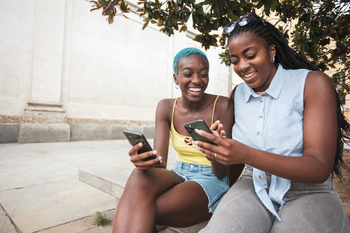 Worried About Meta's AI Spend? It's Already Paying Off.: https://g.foolcdn.com/editorial/images/868001/social-media-smartphone-two-women.jpg