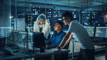 I Bought Atlassian Stock When It Was Down 87%, and Now It's Soaring. These Were My Reasons.: https://g.foolcdn.com/editorial/images/868564/a-team-of-it-professionals-looking-at-a-computer-inside-a-dark-office.jpg