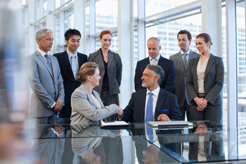 Is This a Sign Pfizer's Aggressive Growth Strategy Is Paying Off?: https://g.foolcdn.com/editorial/images/869373/business-people-shaking-hands-in-conference-room.jpg