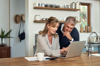 3 High-Yielding Dividend Stocks Trading at Dirt Cheap Valuations: https://g.foolcdn.com/editorial/images/870708/a-couple-looking-at-a-computer-screen.jpg