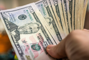 Want $1,000 in Annual Passive Income? Here's How Much to Invest in This High-Yield Energy Stock: https://g.foolcdn.com/editorial/images/850448/a-hand-holding-50-bills.jpg