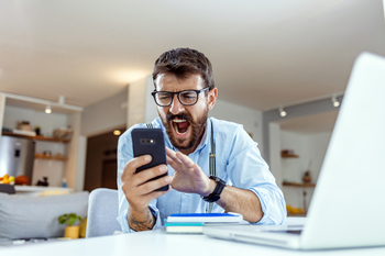 Could XRP Fall Below $1?: https://g.foolcdn.com/editorial/images/854414/angry-investor-with-smartphone.jpg