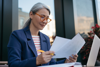 3 Ways Working 1 More Year Could Boost Your Social Security Benefit: https://g.foolcdn.com/editorial/images/855235/mature-businessperson-reading-documents.jpg