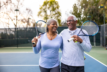5 Reasons Florida Really Is the Best State to Retire In: https://g.foolcdn.com/editorial/images/855250/laughing-couple-holding-tennis-rackets.jpg