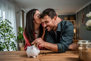 Is 2026 the Year of Dividend Stocks? These 2 Income-Focused ETFs Have Been Soaring Past the S&P 500: https://g.foolcdn.com/editorial/images/855319/an-excited-couple-putting-money-in-a-piggy-bank.jpg