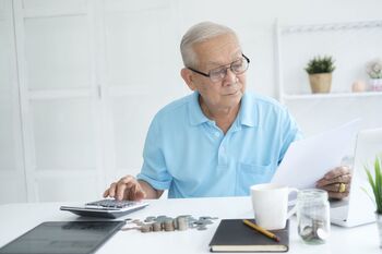2 Vanguard ETFs That Could Turn $400 Per Month Into $1 Million: https://g.foolcdn.com/editorial/images/855318/a-person-calculating-their-finances.jpg