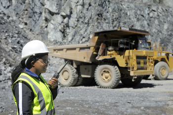 Where Will USA Rare Earth Be in 5 Years?: https://g.foolcdn.com/editorial/images/853464/21_05_18-a-person-in-protective-gear-talking-on-a-communications-device-with-a-dump-truck-in-the-background-_gettyimages-155380861.jpg