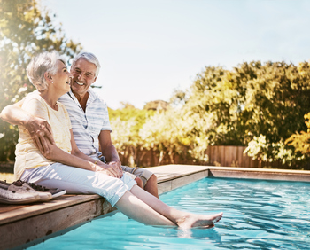 Retiring Abroad? Here's How Your Social Security Benefits Will Be Affected.: https://g.foolcdn.com/editorial/images/855499/smiling-seniors-sitting-by-a-pool.jpg